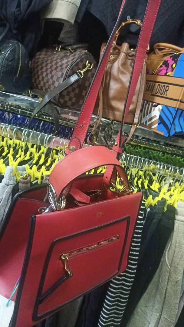 Fendi Red Leather Top Handle Bag (Category: Luxury Bags & Wallets) located in Baguio. Submitted by XycerlynCLXN (Listing ID 1458801003, Image 3). Description: - Genuine red leather Fendi bag - Front zip pocket for quick access - Interior zip pocket and slip pocket for organization - Elegant gold hardware details - Includes a detachable shoulder strap for versatile carrying - Ideal for both daily errands and special events.