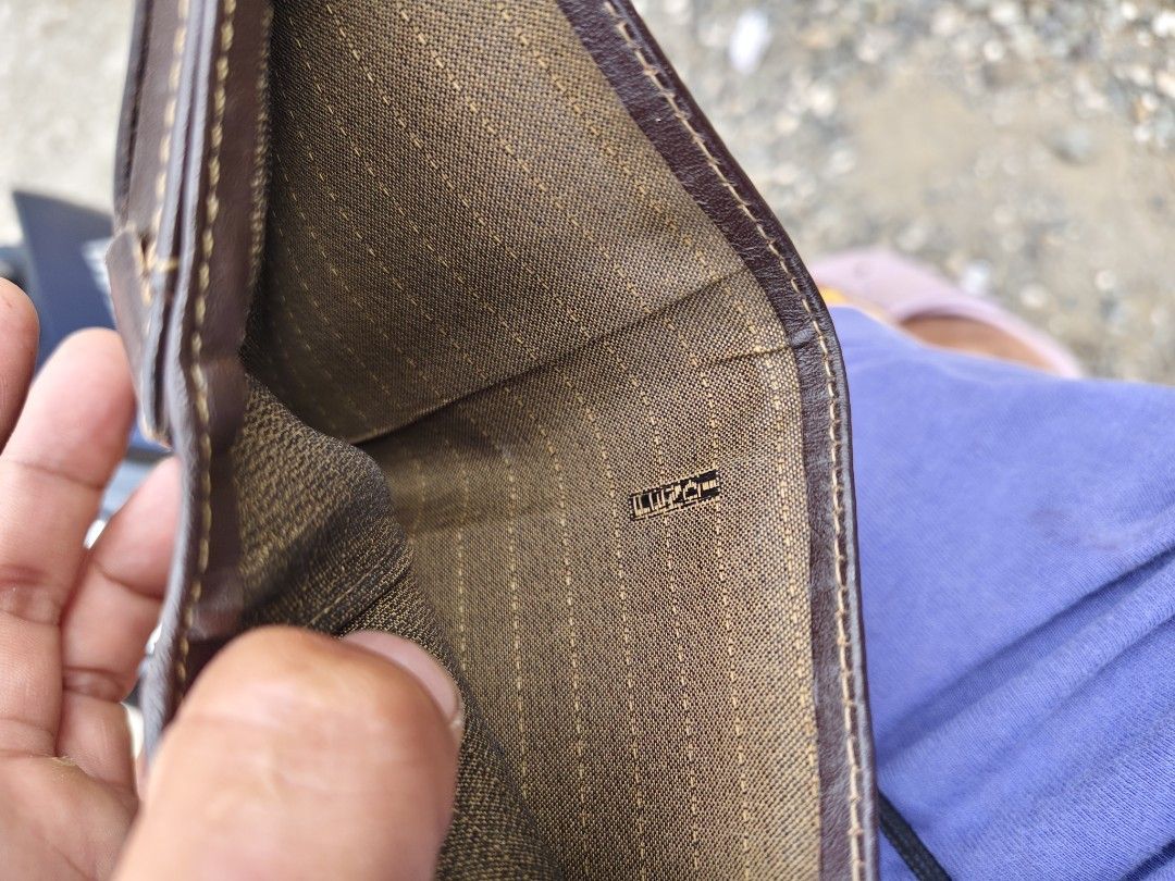 Fendi Zucca Monogram Bifold Wallet (Category: Luxury Bags & Wallets) located in Tagbilaran City. Submitted by bossjepoy (Listing ID 1458726473, Image 3). Description: - Authentic Fendi wallet - Classic brown & black Zucca monogram pattern - Genuine leather trim - Interior zippered coin pocket - Shows some signs of wear (leather & lining), but plenty of life left - Perfect for Fendi collectors.