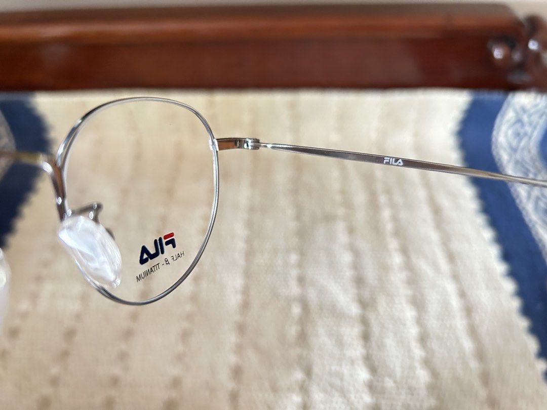 FILA Unisex Round Shape Grey Frame (Category: Sunglasses & Eyewear) located in Polangui. Submitted by joycehaul (Listing ID 1458786593, Image 2). Description: Material Construction: These frames utilize Beta-Titanium (β-titanium). This lightweight alloy offers superior flexibility, durability, and corrosion resistance compared to standard metals. It is also hypoallergenic, making it comfortable for all-day skin contact. Frame Style: They are desi