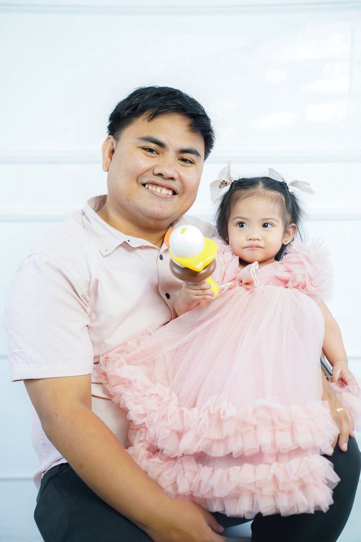 First Birthday Princess Dress (Category: Babies & Kids Fashion) located in Makati City. Submitted by bree73 (Listing ID 1458830495, Image 2). Description: - Worn twice photoshoot and birthday only - Beautiful pink tulle dress for toddlers - Features abundant ruffles and a charming front bow - Made from soft and flowy fabric - Includes matching hair accessories - Ideal for parties, special occasions, and photoshoots.