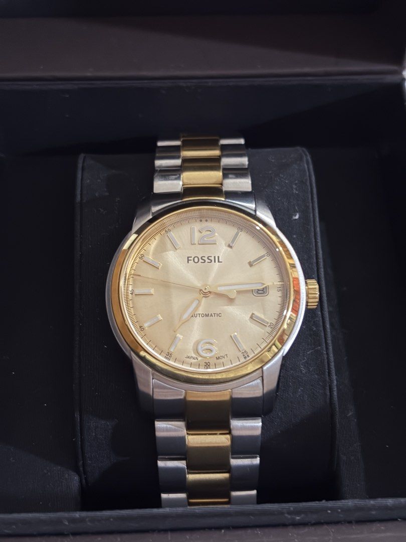 Fossil Heritage Automatic Watch Two-Tone Stainless Steel (Category: Men's Watches) located in Santo Tomas. Submitted by kencrngl (Listing ID 1458693722, Image 2). Description: - Fossil Heritage Automatic Watch - Two-tone stainless steel band (gold and silver) - See the automatic movement through the case back - Water resistant up to 5 ATM - Model: ME3228 -38mm - Comes with original Fossil Heritage box.