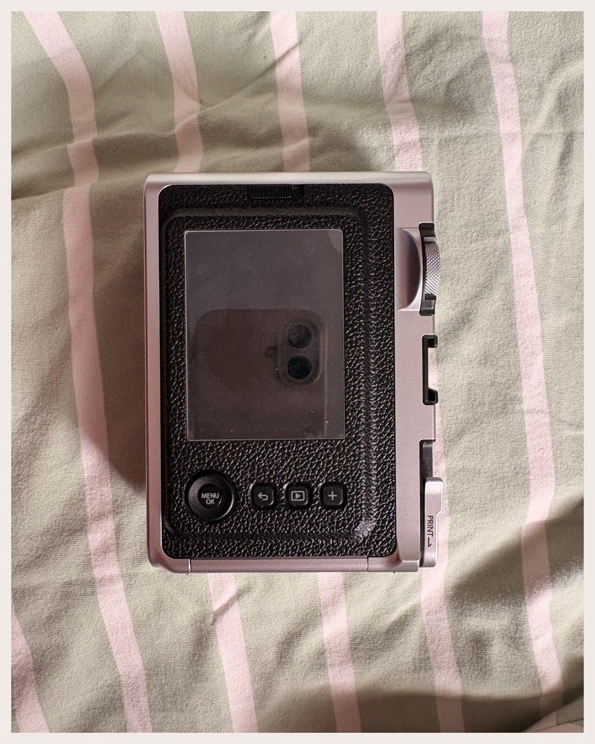 Fujifilm Instax Mini Evo (Category: Cameras) located in Baler. Submitted by sunshinesmostloved (Listing ID 1458714278, Image 3). Description: Hi! I’m selling my Fujifilm Instax Mini Evo, it’s a hybrid digital camera that lets you take photos that you can print, or choose the photos that you print via Bluetooth. I loved it so much but I got very busy and the life of having this camera is not for me 😅 • there is a screen protector attached, which 