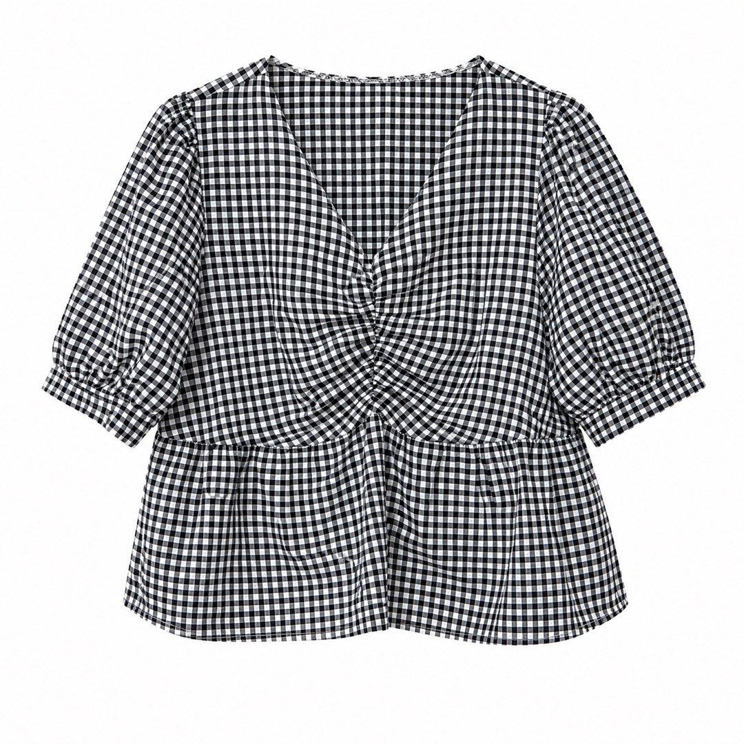 Gingham Top (Category: Blouses) located in San Pedro. Submitted by cutiepagong (Listing ID 1458785452, Image 1). Description: - Classic black and white gingham pattern - Flattering V-neckline with a twist front detail - Trendy puff sleeves - Flared peplum hem for a feminine silhouette - Versatile design for casual or dressed-up looks.