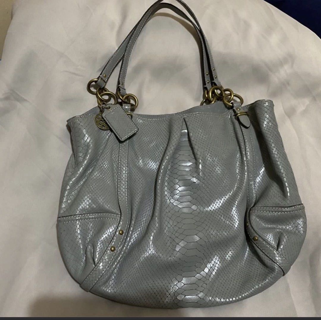 Grey Coach Embossed Leather Shoulder Bag (Category: Luxury Bags & Wallets) located in Bacolod City. Submitted by tserizaeo (Listing ID 1458836431, Image 3). Description: - Grey leather shoulder bag - Embossed snake pattern - Brass hardware details - Interior zip and slip pockets - Clean inside - Great everyday bag - Fits essentials.