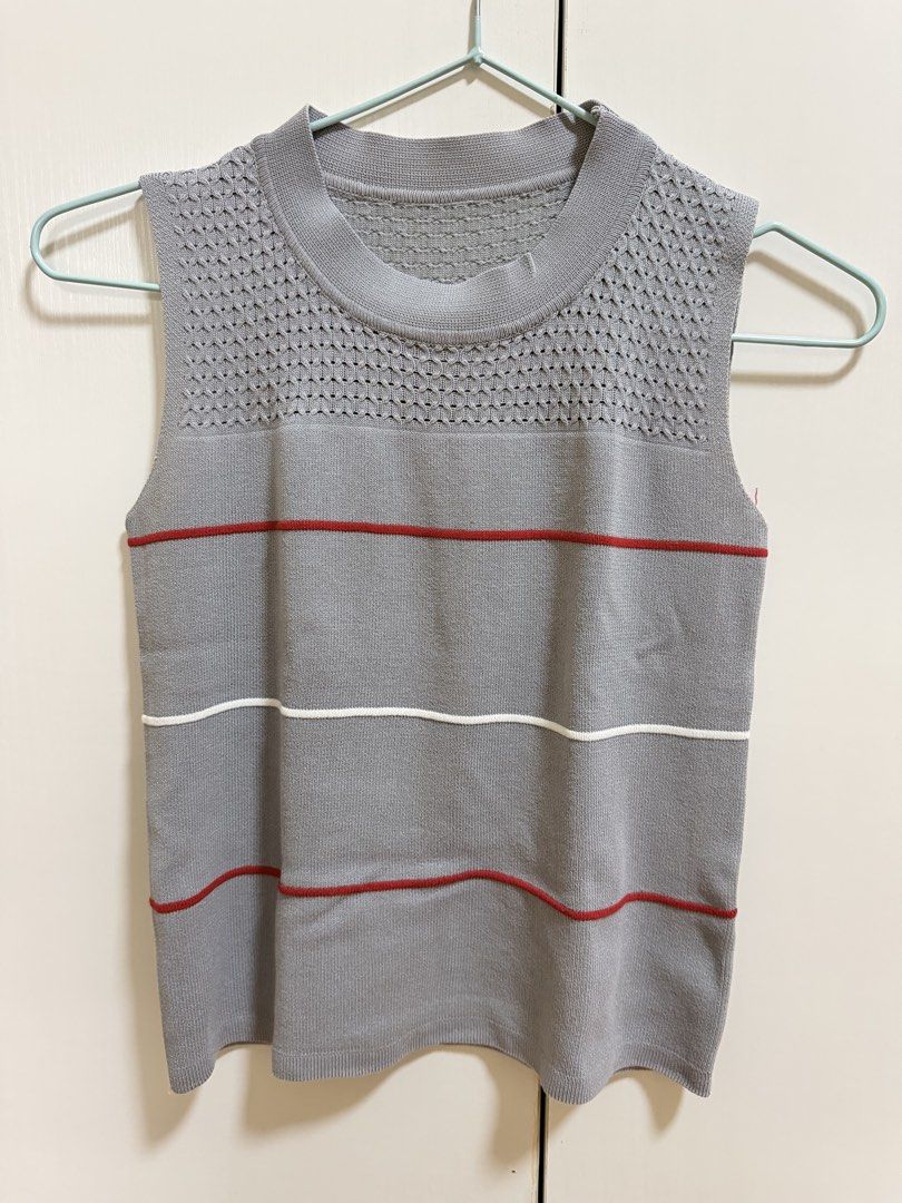 Grey Sleeveless Knit Top (Category: Sleeveless) located in Mexico. Submitted by kjoybernabe (Listing ID 1458743255, Image 1). Description: - Grey knit sleeveless top - Textured knit detail at neckline - Red and white horizontal stripes - Versatile for layering or wearing alone.