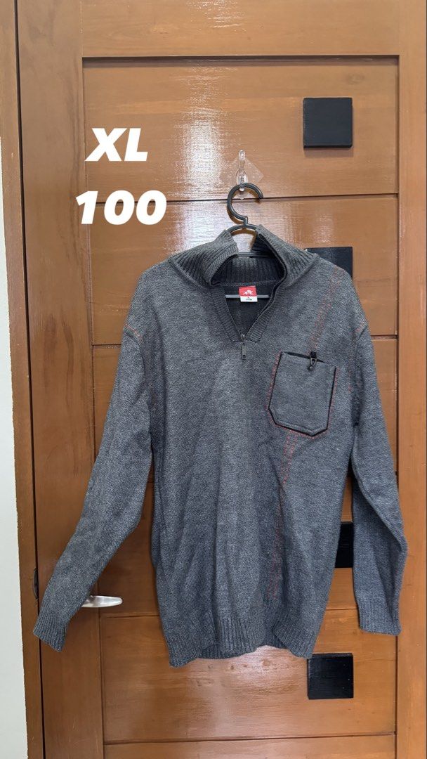 Grey XL Sweater with Half Zip and Pocket (Category: Coats, Jackets and Outerwear) located in Makati City. Submitted by deadseaaa (Listing ID 1458774919, Image 1). Description: - Grey knit sweater - Size XL - Half-zip neckline - Chest pocket with button closure - Red stitching details on pocket and front - Ribbed cuffs and hem - Ideal for layering.