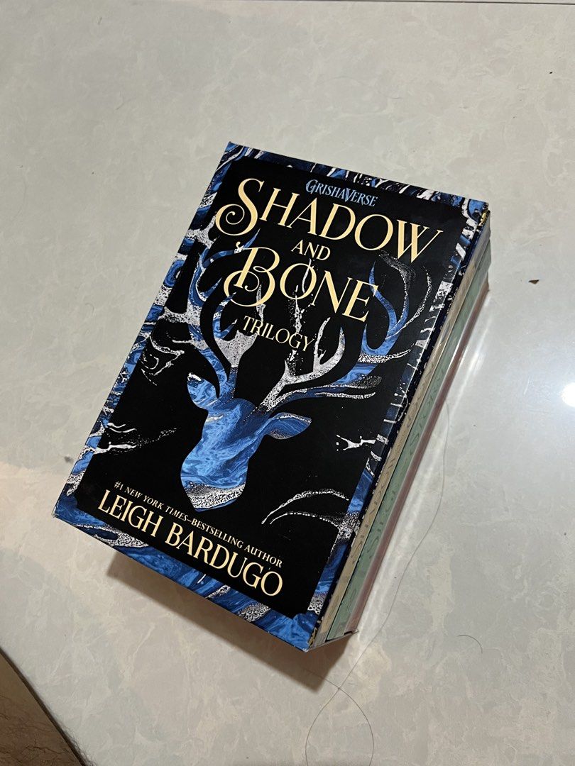 Grishaverse Shadow and Bone Trilogy Box Set by Leigh Bardugo (Category: Storybooks) located in Manila. Submitted by juliusfrancis (Listing ID 1458829082, Image 1). Description: - Complete Shadow and Bone Trilogy box set by Leigh Bardugo - Includes: Shadow and Bone, Siege and Storm, Ruin and Rising ✅ Original copy (bought from Fully Booked) ✅ Good as new (unsealed but haven’t been used) ✅ No tears, foxing, scratches, or other issues 💰 ₱1500 (pric