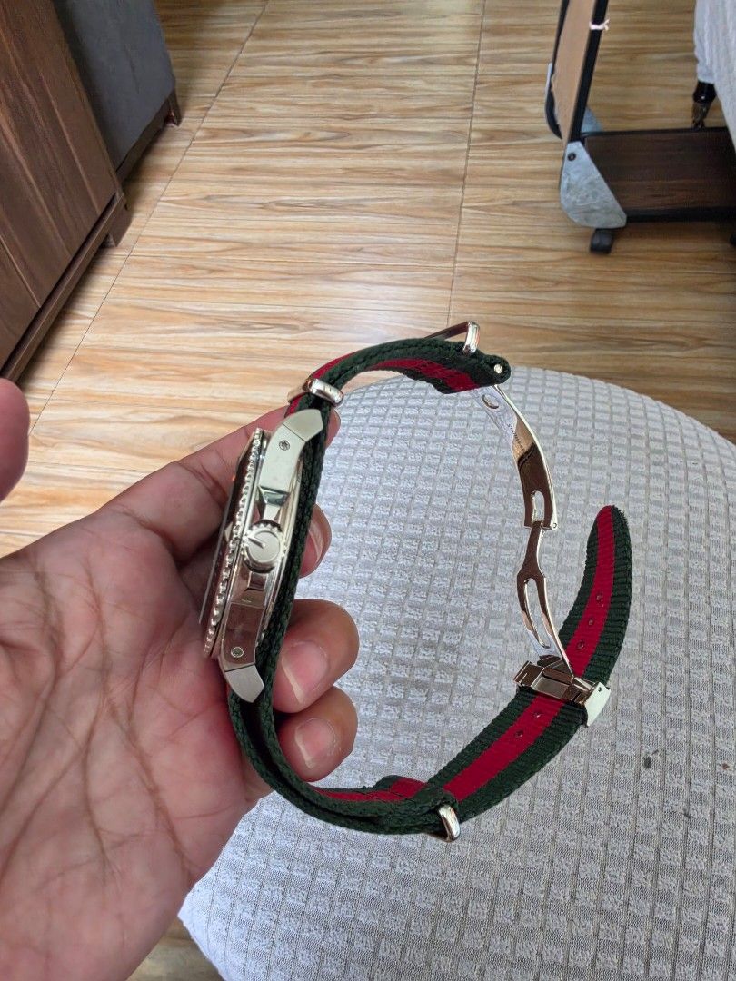 Gucci Dive Watch Black Dial Green Red Strap (Category: Luxury Watches) located in Quezon City. Submitted by deng43763 (Listing ID 1458701594, Image 3). Description: - Gucci Dive Watch - Black Dial - Iconic Green and Red Stripe NATO Strap - Water Resistant 200m/660ft - Original Gucci Box and Packaging Included - Suitable for everyday wear or diving.
