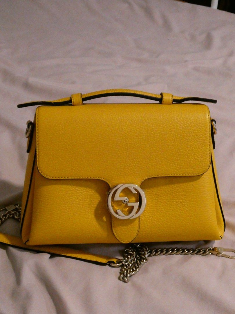 Gucci Interlocking Bag (Category: Luxury Bags & Wallets) located in Quezon City. Submitted by shopwithfrance (Listing ID 1458802504, Image 1). Description: Banana Yellow Gucci Interlocking Bag New and stored Personally bought in France Gucci outlet for ₱85,000 Comes with dust-bag, box, authenticity pamphlets/cards, receipt..