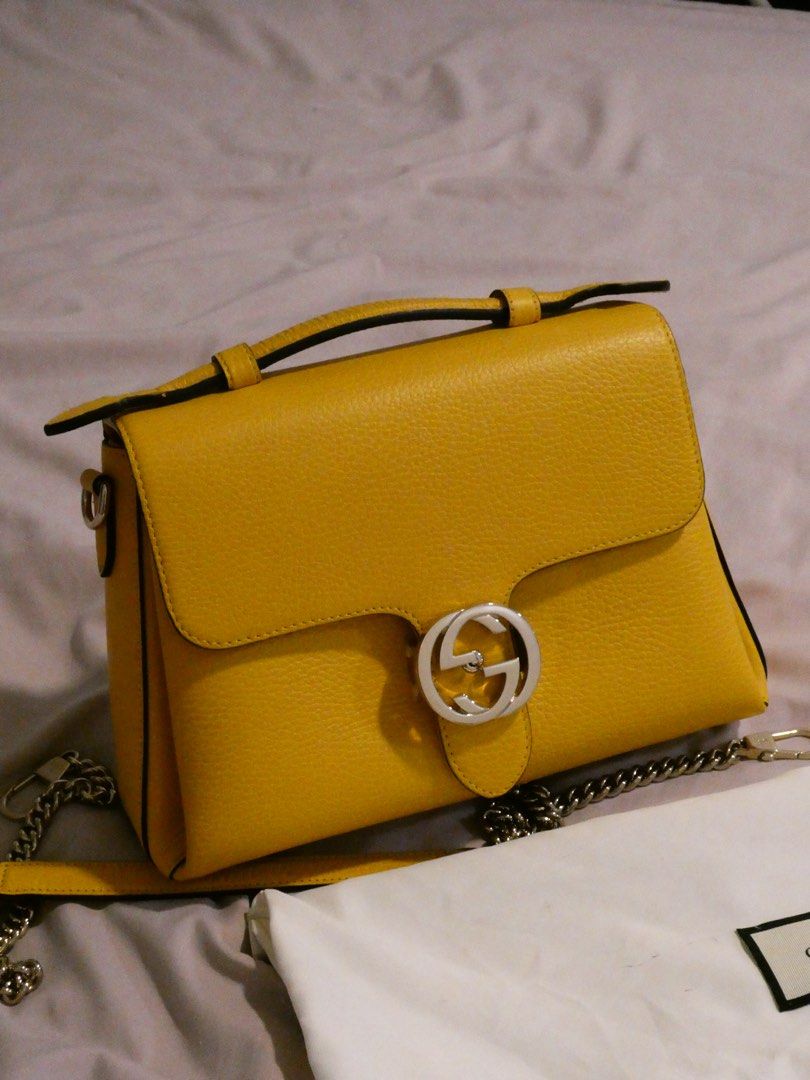 Gucci Interlocking Bag (Category: Luxury Bags & Wallets) located in Quezon City. Submitted by shopwithfrance (Listing ID 1458802504, Image 2). Description: Banana Yellow Gucci Interlocking Bag New and stored Personally bought in France Gucci outlet for ₱85,000 Comes with dust-bag, box, authenticity pamphlets/cards, receipt..