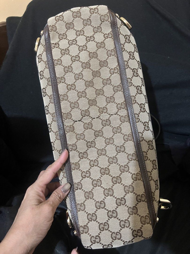 Gucci Monogram Canvas Tote Bag (Category: Luxury Bags & Wallets) located in San Mateo. Submitted by dona0210 (Listing ID 1458797514, Image 3). Description: - Authentic Gucci tote bag - rank SA - Classic GG monogram canvas - Dark brown leather trim - Gold hardware details - Top zip closure - Spacious interior Lay away or Installment term accepted - Great everyday bag .