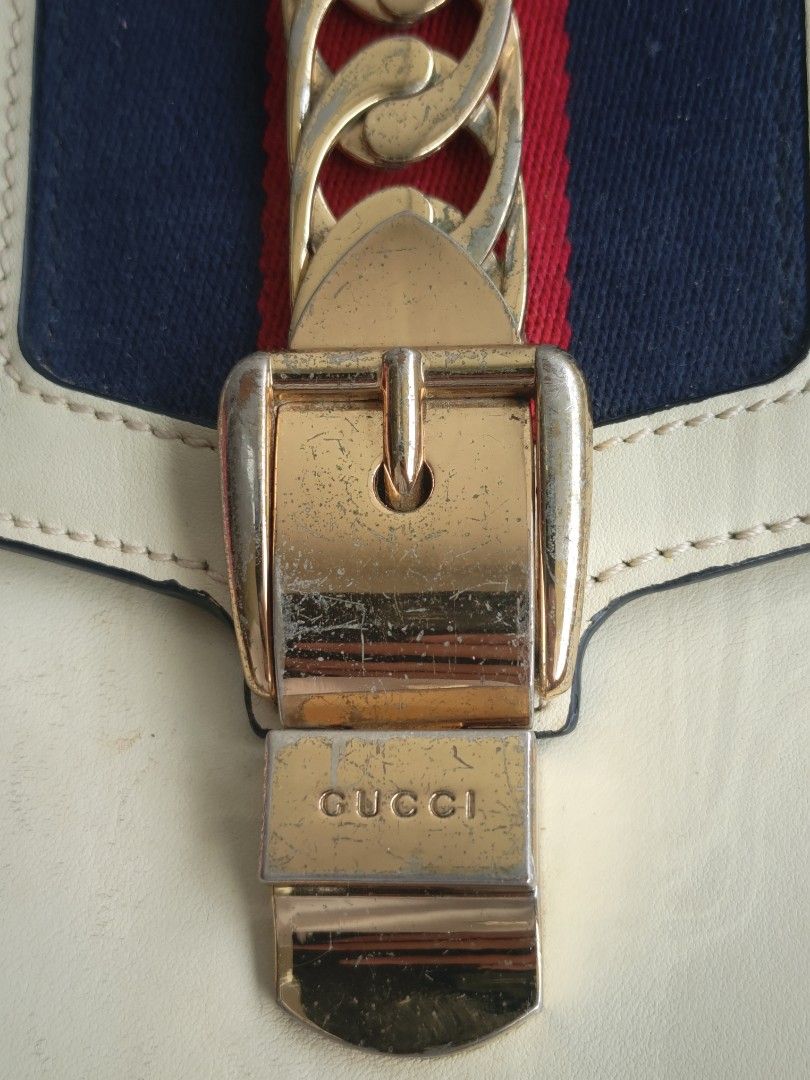 Gucci Sylvie Leather Shoulder Bag Cream (Category: Luxury Bags & Wallets) located in Cavite. Submitted by benta_bounce (Listing ID 1458785747, Image 3). Description: - Cream Leather Gucci Bag - Features iconic Sylvie Web Stripe - Signature Chain Detail - Gold Hardware - Minor signs of wear on leather and hardware (as pictured) - Comes with detachable shoulder strap - A classic, timeless piece.
