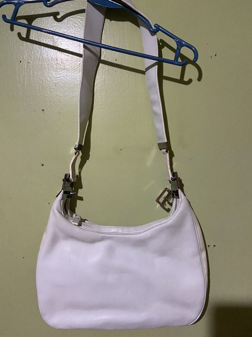 Gucci White Leather Shoulder Bag (Category: Luxury Bags & Wallets) located in Tarlac. Submitted by pangz0918 (Listing ID 1458817980, Image 2). Description: - Gucci white leather shoulder bag - Classic hobo shape - Silver hardware details - Made in Italy - Clean interior - Adjustable strap - Great everyday bag, fits essentials -a bit dirt so now not too white -no more box and dust bag.