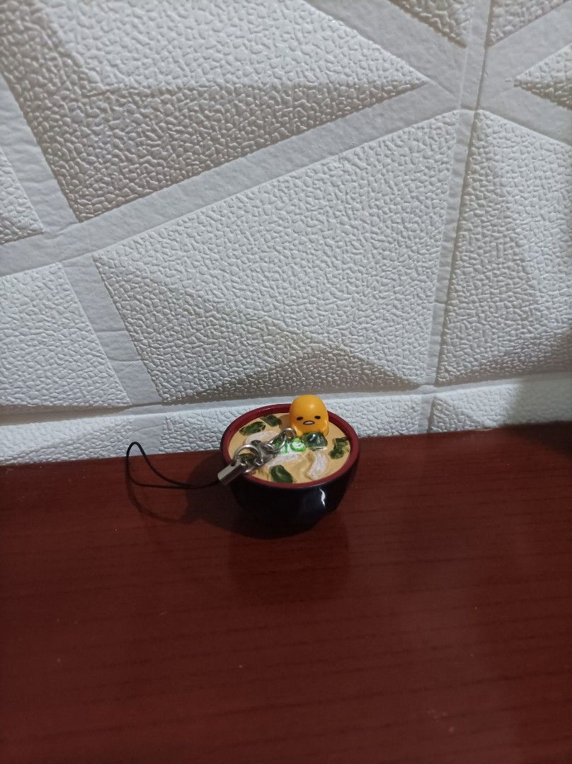 Gudetama Ramen Charm (Category: Character Goods) located in Bacoor. Submitted by kuroochiii94695 (Listing ID 1458725412, Image 1). Description: - Adorable Gudetama charm in a ramen bowl design. - Includes a convenient strap for easy attachment. - Features a small, cute metal charm. - Ideal for decorating bags, phones, or as a collectible. - A must-have for any Gudetama enthusiast!.