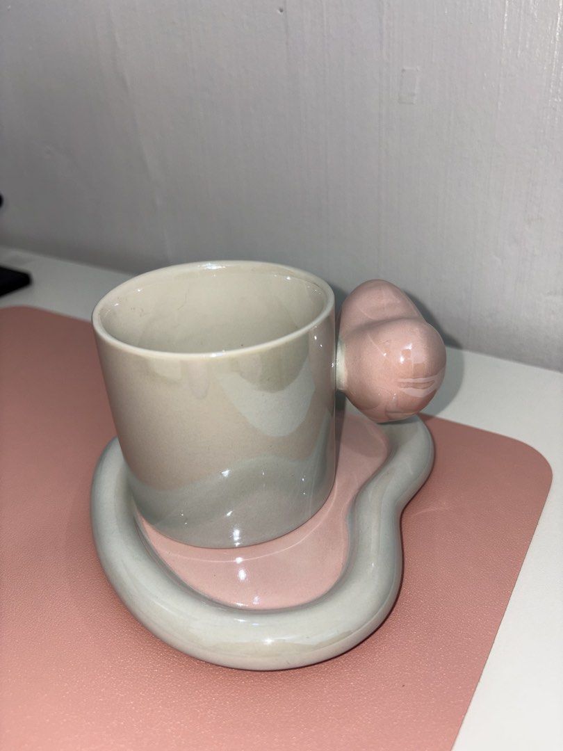 Heart Ceramic Cup and Saucer Set (Category: Coffee & Tea Tableware) located in Taguig. Submitted by jsmnsl (Listing ID 1458864374, Image 3). Description: Ceramic Pearl Iridescent Mug 💗 It comes with a matching heart-shaped saucer and the cutest heart-shaped handle! ✨ Available in Pink, Blue & Green 🩷🩵💚 ₱350 only! You won’t find these cuties in Metro Manila 👀 DM me if you want one! 🎀 Limited pieces only! ✨ - Adorable heart-shaped cup and sau