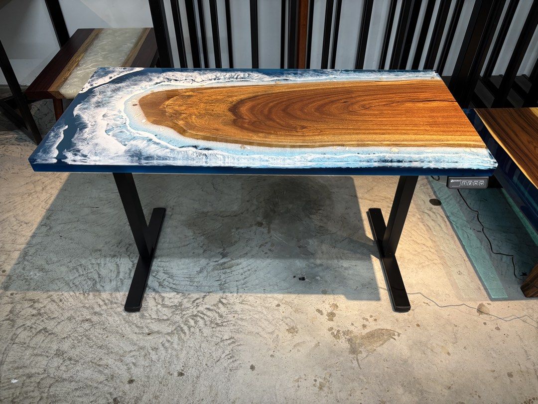 Height Adjustable Solid Wood Table (Category: Tables & Sets) located in Singapore. Submitted by globaloceanwoodmy (Listing ID 1458842476, Image 2). Description: Brand New Solid Wood Epoxy Resin Table With Electric Height Adjustable Frame Wood Species: Keranji Size: 1300x600mm Colour Series: Ocean & Wave Adjustable Range: 730-1180mm *Free delivery and assembly service. Beautiful ocean theme epoxy resin table top with high quality electric height a