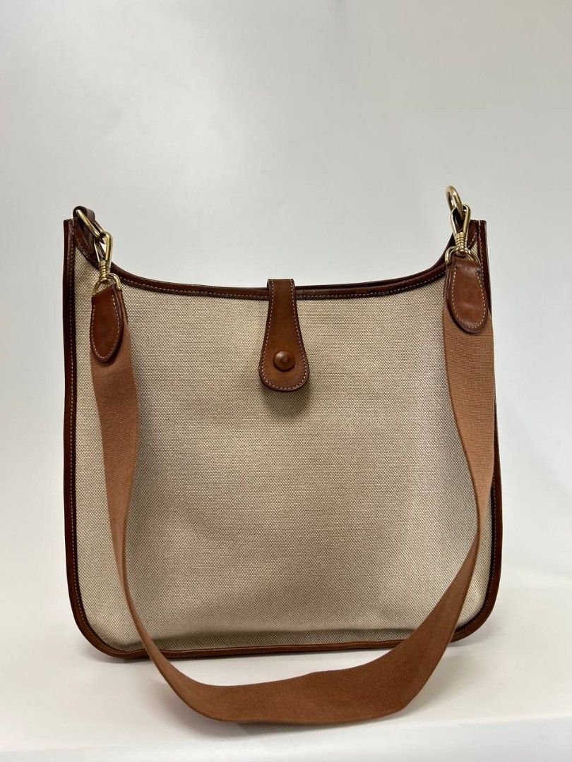 Hermes Evelyn (Category: Luxury Bags & Wallets) located in Quezon City. Submitted by cornelle_luxuryph (Listing ID 1458807210, Image 3). Description: H3rmes Evelyn Bag in beige canvas and brown leather combination Condition: 8/10, Very Good Condition Dimension: 30cm (W) x 33cm (H) x 8cm (D) Price: 78,900 pesos only + optional legitgrails certificate of authenticity for 1,300 pesos only 100% authentic | Money back guarantee ⚠️ Disclaimer: Cornelle