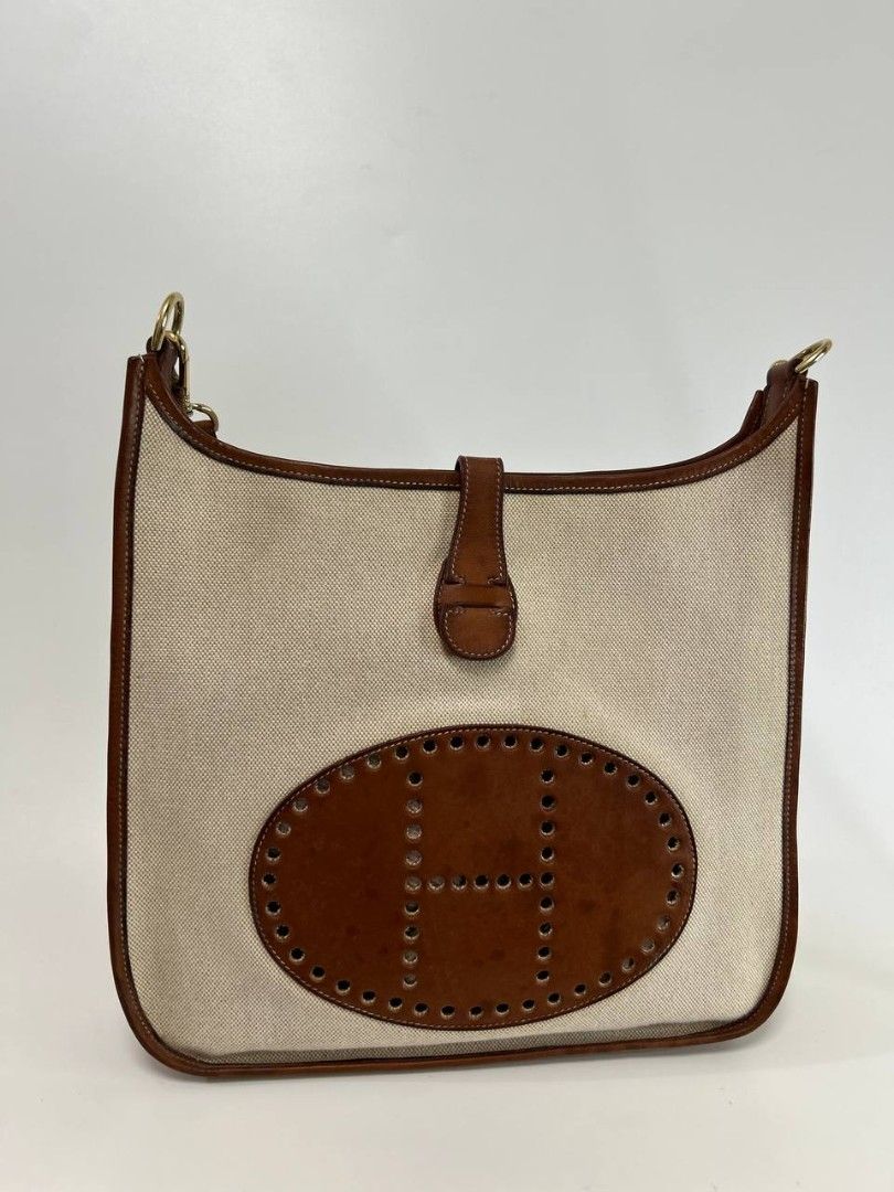 Hermes Evelyn (Category: Luxury Bags & Wallets) located in Quezon City. Submitted by cornelle_luxuryph (Listing ID 1458807210, Image 1). Description: H3rmes Evelyn Bag in beige canvas and brown leather combination Condition: 8/10, Very Good Condition Dimension: 30cm (W) x 33cm (H) x 8cm (D) Price: 78,900 pesos only + optional legitgrails certificate of authenticity for 1,300 pesos only 100% authentic | Money back guarantee ⚠️ Disclaimer: Cornelle