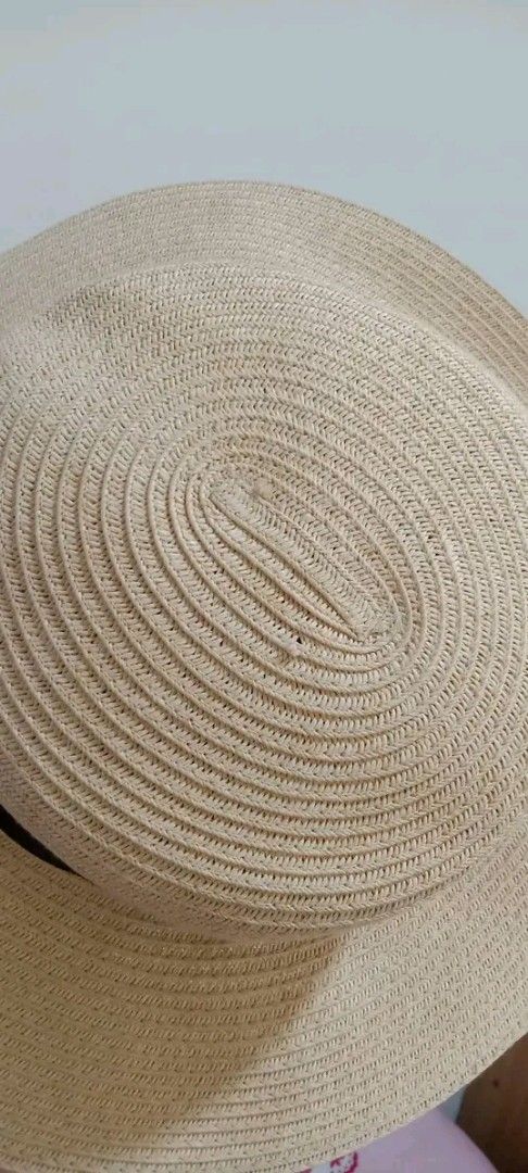 H&M Straw Hat with Black Ribbon (Category: Hats & Beanies) located in Gapan. Submitted by montesnora80204 (Listing ID 1458781109, Image 2). Description: - Wide brim straw hat from H&M - Natural straw color with a black ribbon band - Ideal for sunny days and outdoor activities - Provides sun protection - Lightweight and easy to pack for travel - Versatile for beach trips or casual outfits.