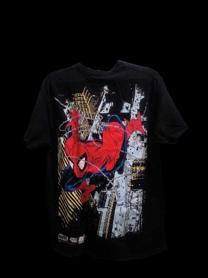 HUF Marvel Spider-Man T-Shirt SALE/SWAP (Category: Tshirts & Polo Shirts ) located in Muntinlupa City. Submitted by narymadine_ (Listing ID 1431278433, Image 2). Description: Black HUF t-shirt featuring a Spider-Man graphic on the front and back. The shirt has a Marvel Comics logo on the tag. It is a size medium. The shirt has a crew neck and short sleeves. The graphic on the front shows Spider-Man swinging. The back graphic shows a different Spi