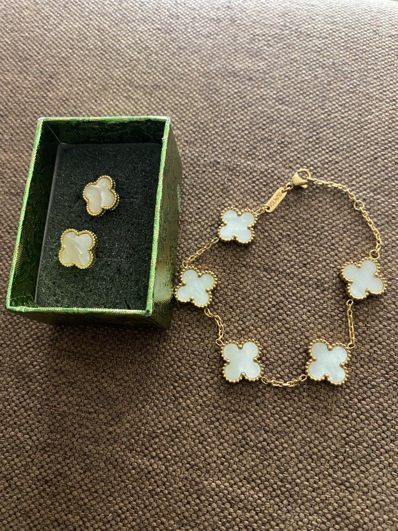 Inspired Clover Bracelet and Earrings Set (Category: Bracelets) located in Makati City. Submitted by dpjanssen (Listing ID 1458712674, Image 1). Description: - Beautiful clover motif bracelet and matching earrings set. - Gold-tone chain with elegant mother-of-pearl inlay. - Bracelet features a secure clasp closure. - Arrives in a lovely green gift box. - Adds a touch of sophistication to any outfit. - last price posted.
