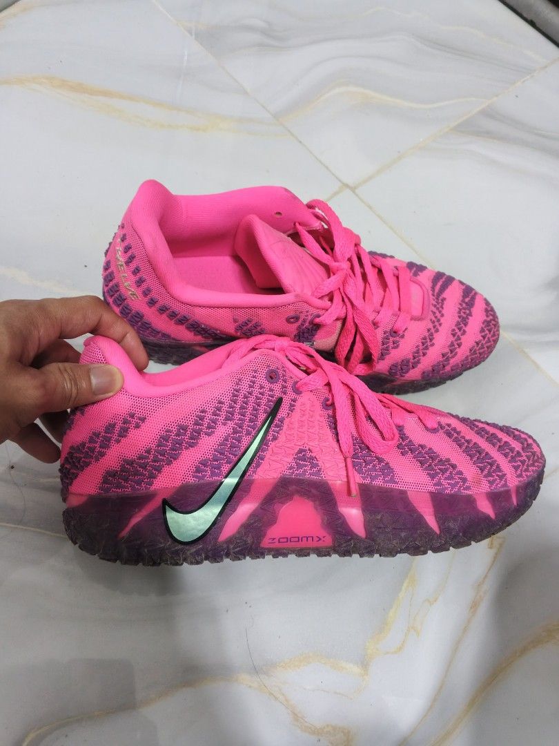 Ja Morant 3 / Ja3 (Category: Sneakers) located in Manila. Submitted by saitamanards (Listing ID 1458836066, Image 1). Description: may box pa po, pinang jogging lang to 3x matigas pa, ua quality po need lang extra budget. - Bright pink Nike ZoomX running shoes - Unique textured pattern on the upper - Light mint green Nike swoosh - Pink laces - Ideal for running and workouts and playing basketball.