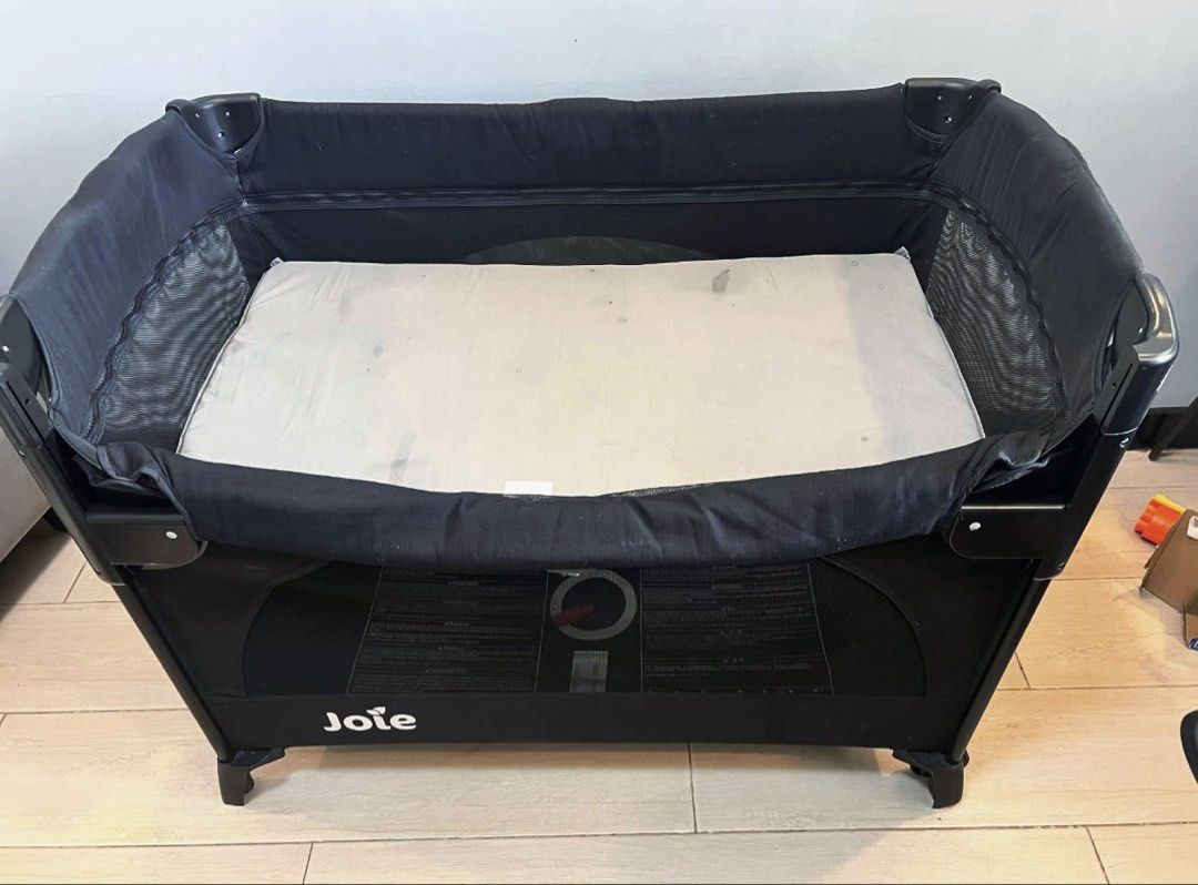 Joie Kubbie Sleep Playpen Crib (Category: Cots & Cribs) located in Taguig. Submitted by prelovedjoys19 (Listing ID 1458768314, Image 1). Description: Joie Kubbie Sleep Playpen Crib - Easy to set-up and fold - Folds compactly and comes with storage bag Color: Black with mesh sides Condition: Used 6 months / With stains on the mattress due to storage Location: Acacia Estates, Taguig .