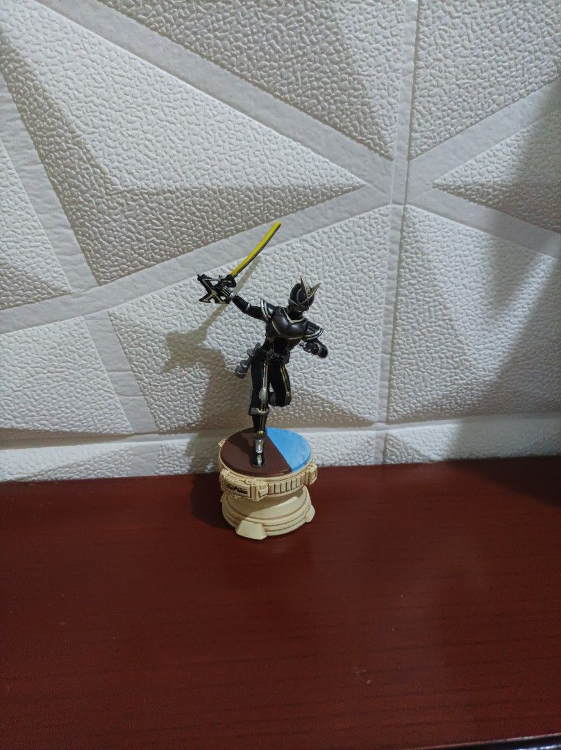 Kamen Rider W Figure with Sword (Category: Figurines & Statues) located in Bacoor. Submitted by kuroochiii94695 (Listing ID 1458725520, Image 1). Description: - Authentic Kamen Rider W action figure - Comes with a vibrant yellow sword accessory - Features a circular display base with blue and brown accents - Ideal for collectors and fans of the Kamen Rider series - Feel free to ask any questions!.