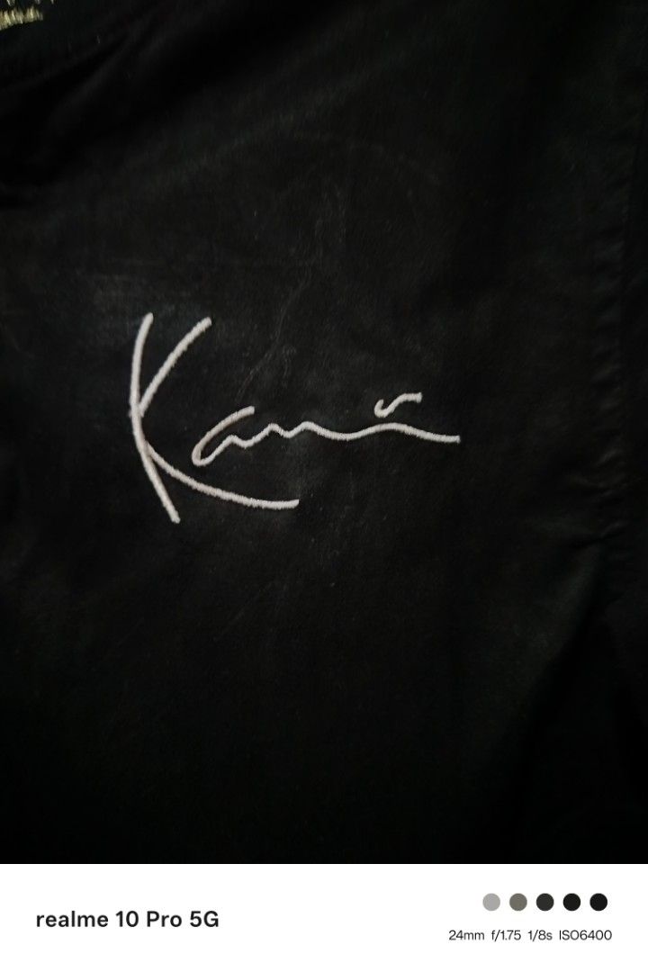 Karl Kani Brooklyn Bomber Jacket (Category: Coats, Jackets and Outerwear) located in Manila. Submitted by cleverturtle-2982 (Listing ID 1458765684, Image 3). Description: - Black Karl Kani bomber jacket - Size: Medium - Embroidered Karl Kani logo on the front - Large Karl Kani lettering on the back - Zipper pull with Brooklyn logo detail - Ideal for casual wear.