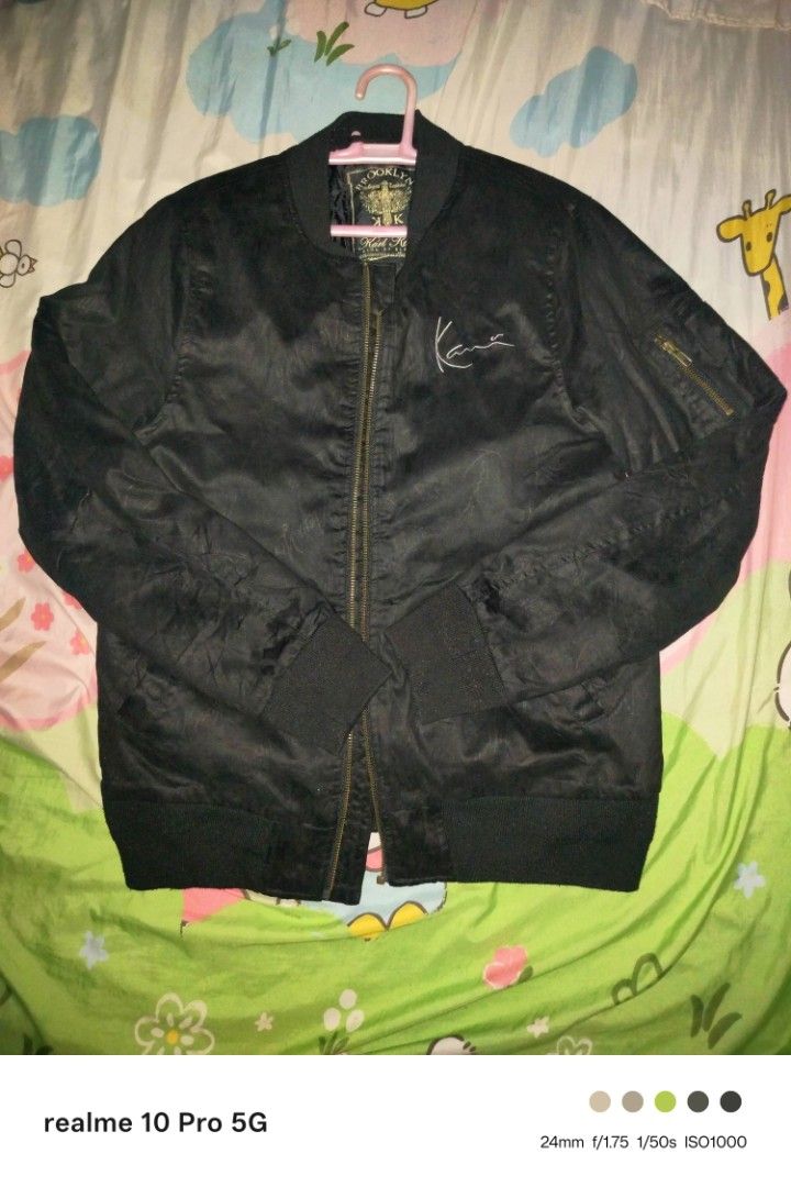 Karl Kani Brooklyn Bomber Jacket (Category: Coats, Jackets and Outerwear) located in Manila. Submitted by cleverturtle-2982 (Listing ID 1458765684, Image 1). Description: - Black Karl Kani bomber jacket - Size: Medium - Embroidered Karl Kani logo on the front - Large Karl Kani lettering on the back - Zipper pull with Brooklyn logo detail - Ideal for casual wear.