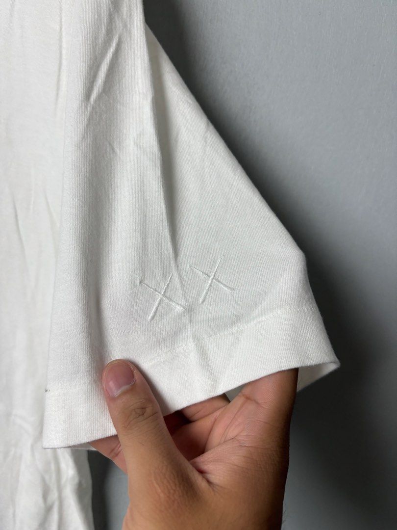 Kaws x Uniqlo T-Shirt (Category: Tshirts & Polo Shirts ) located in Mandaluyong City. Submitted by fellas_ph (Listing ID 1458809527, Image 3). Description: Excellent condition No issues Size L, fits M 20" Width 28.5" Length.