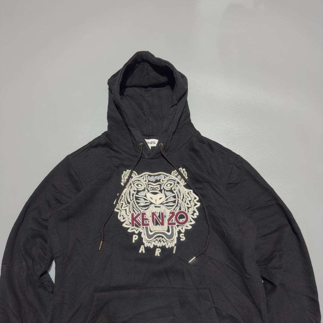 Kenzo Black Classic Gold/Brown Tiger Pullover Hood (Category: Luxury Apparel) located in Alburquerque. Submitted by getniceph2022 (Listing ID 1458741208, Image 3). Description: Kenzo Black Classic Gold/Brown Tiger Pullover Hood - Size small Measurements: 21 inch width. 26 inch length. Excellent condition!.