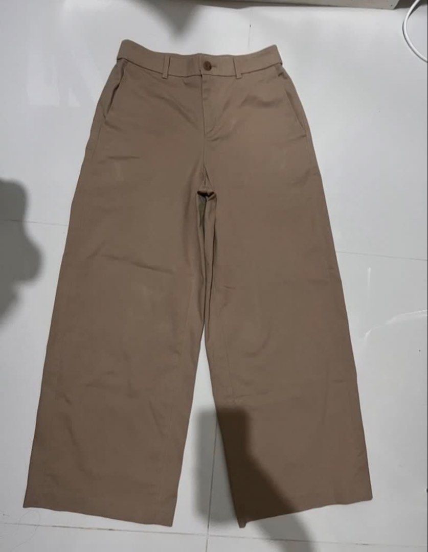 Khaki Wide Leg Cropped Pants (Category: Other Bottoms) located in Angono. Submitted by malijia (Listing ID 1458844190, Image 1). Description: - Khaki colored pants - Wide leg and cropped style - Front pockets - Button and zip closure - Simple and versatile for everyday wear - Great for casual outfits.