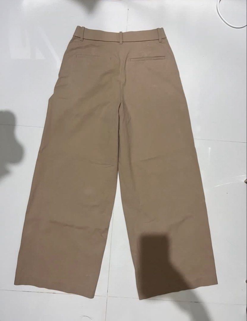 Khaki Wide Leg Cropped Pants (Category: Other Bottoms) located in Angono. Submitted by malijia (Listing ID 1458844190, Image 2). Description: - Khaki colored pants - Wide leg and cropped style - Front pockets - Button and zip closure - Simple and versatile for everyday wear - Great for casual outfits.