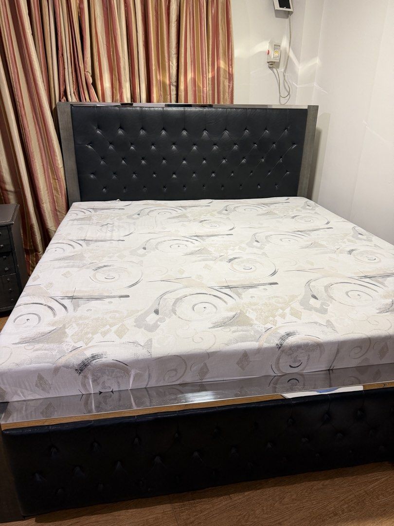 King Size Tufted Bed Frame with Matching Nightstand (Category: Bed Frames & Mattresses) located in Paranaque City. Submitted by captainthanos01 (Listing ID 1458830204, Image 1). Description: - Queen size bed frame - Tufted headboard upholstered in black faux leather - Modern grey wood finish frame - Includes matching 3-drawer nightstand - Nightstand has distressed grey finish and metal hardware - Great set for any bedroom.