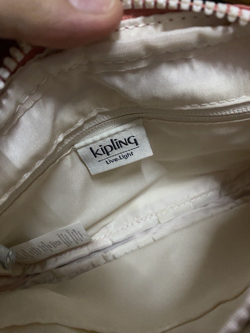 Kipling Abanu Crossbody Bag (Category: Cross-body Bags) located in Quezon City. Submitted by declutterei (Listing ID 1458844117, Image 2). Description: - Kipling crossbody bag in Vintage Pink - Main zippered compartment - Front zippered pocket.