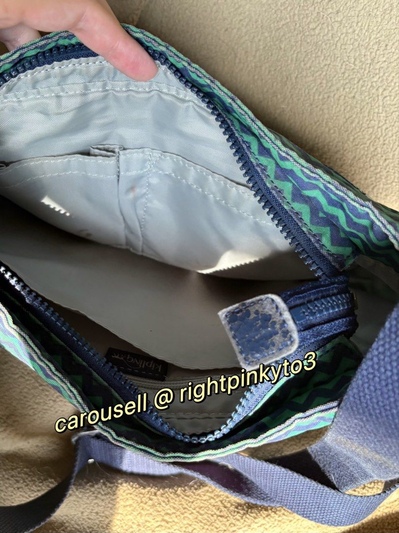 Kipling Zigzag Pattern Crossbody Bag (Category: Cross-body Bags) located in Davao. Submitted by rightpinkyto3 (Listing ID 1458691618, Image 3). Description: Cool zigzag Kipling crossbody bag in blue and green. Features front and main zip pockets, inner pockets, and adjustable strap. Perfect for daily use. Some wear on the leather parts and rust..