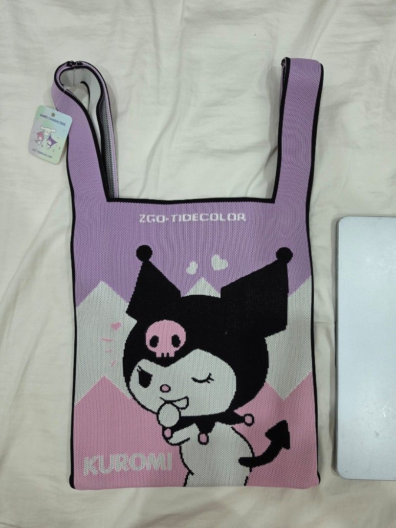 Kuromi Knitted Tote Bag (Category: Tote Bags) located in Manila. Submitted by litphilofashion (Listing ID 1458830559, Image 1). Description: - Adorable knitted tote bag featuring Kuromi -Fits laptop - Stylish purple and pink color combination - Embellished with 'ZGO-TIDECOLOR' text - Ideal for shopping trips or everyday errands - Lightweight and easy to carry.
