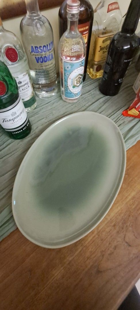 Large-sized tableware (Category: Dinnerware & Cutlery) located in Singapore. Submitted by homemayed (Listing ID 1458766119, Image 3). Description: A collection of large-sized ceramic tableware balancing modern elegance with rustic charm, each piece features unique textures and beautifully subtle color gradients that adds character to your table. White bowls $30 each, $50 for two: 34cm diameter, height 20cm Green oval plate $20 each, $35 for two: 