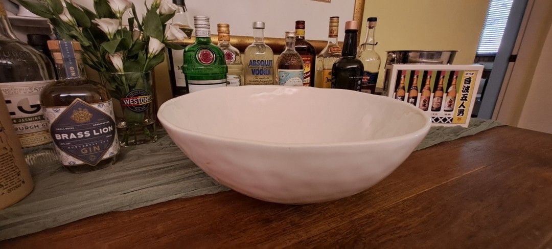 Large-sized tableware (Category: Dinnerware & Cutlery) located in Singapore. Submitted by homemayed (Listing ID 1458766119, Image 1). Description: A collection of large-sized ceramic tableware balancing modern elegance with rustic charm, each piece features unique textures and beautifully subtle color gradients that adds character to your table. White bowls $30 each, $50 for two: 34cm diameter, height 20cm Green oval plate $20 each, $35 for two: 