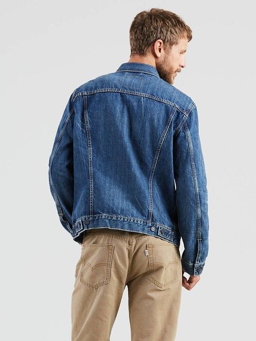 Levi's Trucker Denim Jacket - Classic Blue (Category: Coats, Jackets and Outerwear) located in Angeles City. Submitted by pkthreadz (Listing ID 1458736304, Image 3). Description: - Classic Levi's denim jacket - Medium blue wash - Button front closure - Two chest pockets with button flaps - Side pockets - Standard fit - Ideal for layering or wearing alone - Versatile wardrobe staple - Issue slight fade on collar - 19x25 dimes.