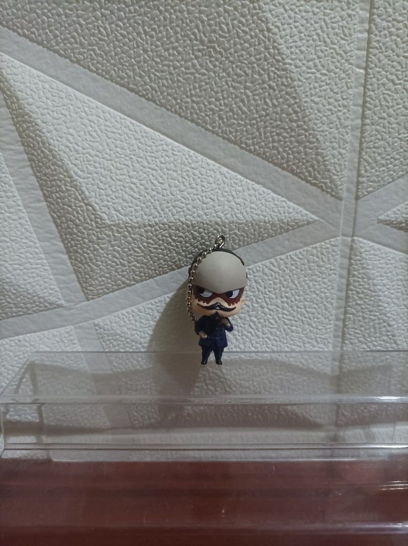 Lieutenant Tsurum Golden Kamuy (Category: Character Goods) located in Bacoor. Submitted by kuroochiii94695 (Listing ID 1458725632, Image 1). Description: - Adorable anime character keychain - Features a figure in a dark uniform - Distinctive and charming face - Comes with a durable metal chain - Ideal for decorating bags, backpacks, or keys - A must-have accessory for anime fans!.