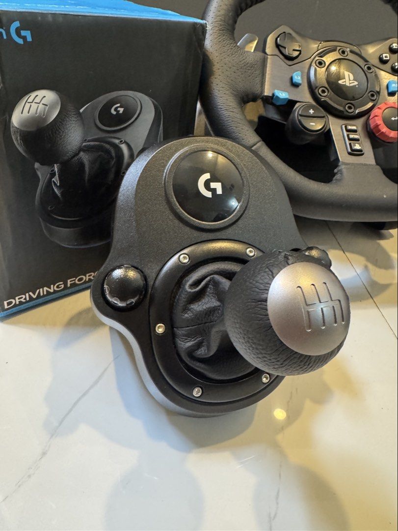 Logitech G29 Driving Force Racing Wheel & Shifter (Category: Controllers) located in Manila. Submitted by lesteriffic (Listing ID 1458868551, Image 3). Description: Logitech G29 Driving Force Steering Wheel & Pedals with Shifter. Compatible with PC/PS4/PS5. Original packaging included. Perfect for racing games! Seldom used for in about 3 months. Comes with box and manuals.