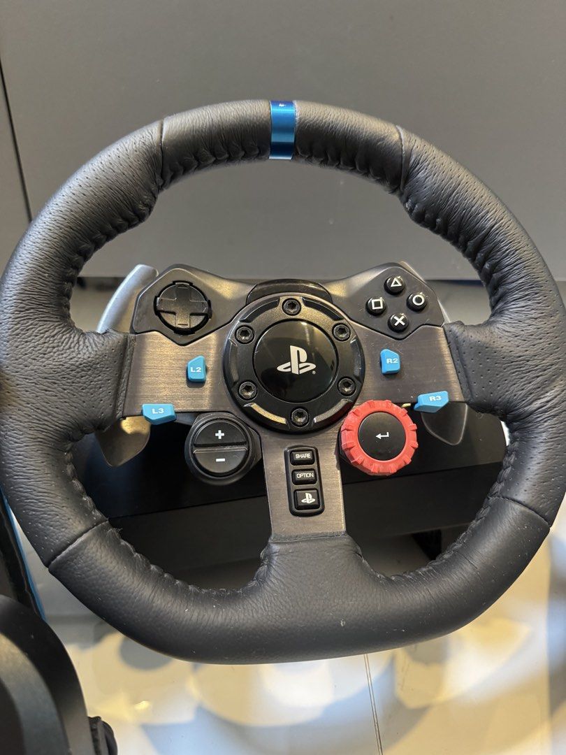 Logitech G29 Driving Force Racing Wheel & Shifter (Category: Controllers) located in Manila. Submitted by lesteriffic (Listing ID 1458868551, Image 2). Description: Logitech G29 Driving Force Steering Wheel & Pedals with Shifter. Compatible with PC/PS4/PS5. Original packaging included. Perfect for racing games! Seldom used for in about 3 months. Comes with box and manuals.