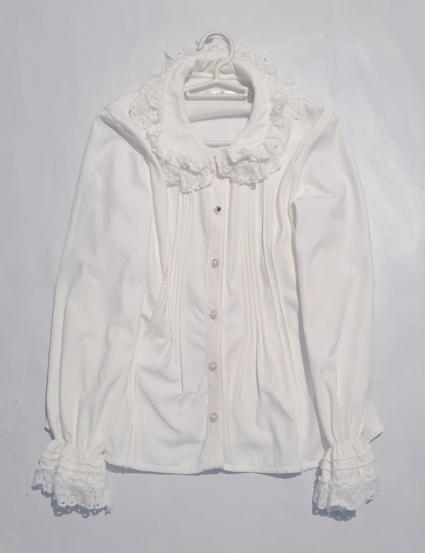 Lolita Blouse (Category: Longsleeves) located in Makati City. Submitted by feltfell (Listing ID 1458796870, Image 1). Description: -fabric is thick (good quality) -color: white -two gems are missing from the buttons (not noticeable) -i can lower price.