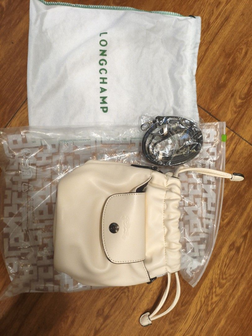 Longchamp Bucket Bag Cream Leather Drawstring (Category: Luxury Bags & Wallets) located in Quezon City. Submitted by ferge88 (Listing ID 1458835854, Image 1). Description: - Cream colored bucket bag - Genuine leather material - Secure drawstring closure - Front flap pocket with iconic Longchamp horse logo - Cute and practical for daily use - Ideal size for carrying your essentials.