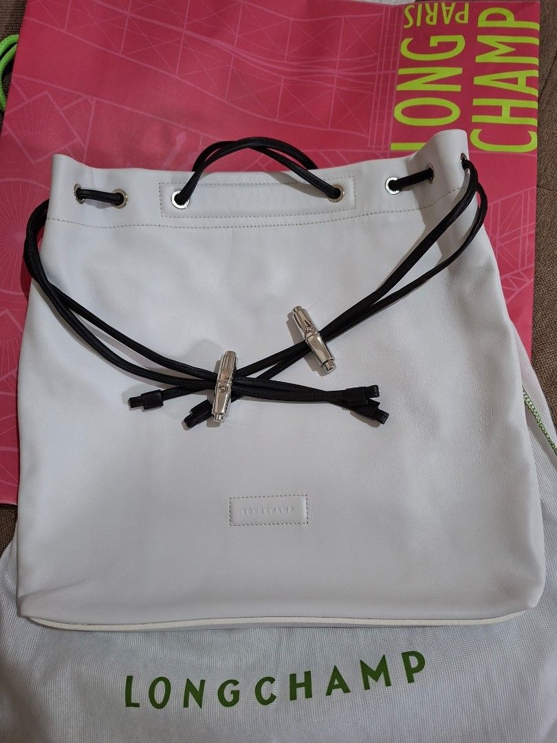 Longchamp Le Roseau Leather Drawstring Tote (Category: Luxury Bags & Wallets) located in Las Pinas. Submitted by xtra_stuff (Listing ID 1458728145, Image 1). Description: - Brand: Longchamp - Material: White Leather - Closure: Drawstring with signature toggle details - Includes: Dust bag - Original Retail Price: $640 - Sale Price: $450 - Ideal for: Everyday use.