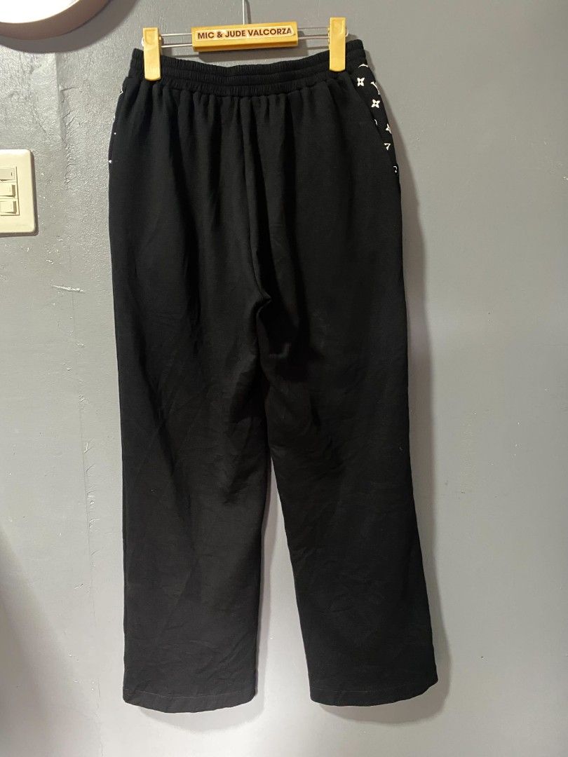 Louis Vuitton Black Monogram Detail Pants (Category: Luxury Apparel) located in Tanay. Submitted by micvalcorza (Listing ID 1458823701, Image 2). Description: - Chic black Trouser pants - Features iconic Louis Vuitton monogram detail on the sides - Comfortable elastic waistband with button closure - Size: Waist 28-30 inches, Length 38 inches - Ideal for casual wear and everyday style - EXCELLENT - 1999 PLUS SHIP.