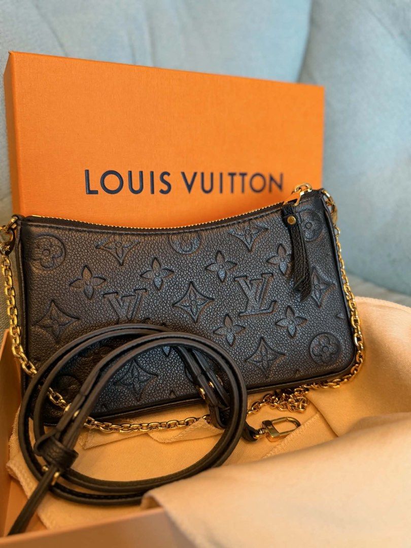 Louis Vuitton Black Monogram Empreinte Pochette (Category: Luxury Bags & Wallets) located in Manila. Submitted by janeca__ (Listing ID 1458763887, Image 2). Description: - Authentic Louis Vuitton Pochette - Color: Black - Material: Empreinte Leather - Features: Embossed Monogram Pattern - Versatile: Detachable leather strap and gold chain for clutch or shoulder bag - Includes: Original Louis Vuitton Box COMPLETE SET For inquiries kindly message m
