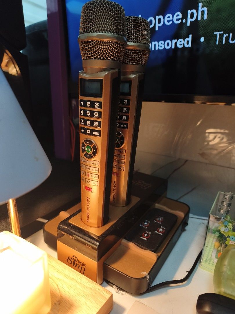 Magic Sing Diamond E-Class Wireless Karaoke Microphones with Dock (Category: Soundbars, Speakers & Amplifiers) located in Pasig City. Submitted by safebear_52fee3 (Listing ID 1458845303, Image 1). Description: - Magic Sing Diamond E-Class wireless karaoke microphones - Color: Gold and Black - Includes charging dock and remote - Tested and working - Original box included - Ideal for home karaoke sessions.